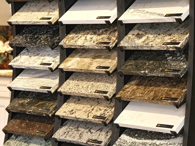 Rack of granite and quartz countertop samples on display at Modern Kitchen